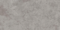 Szara imitująca beton prostokątna płytka na białym tle. Charakterystyczne dla betonu ciemniejsze cieniowanie